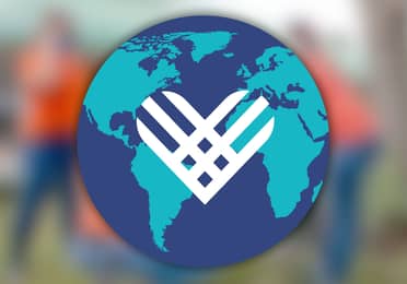 Giving Tuesday Globe logo on top of a blurred image.